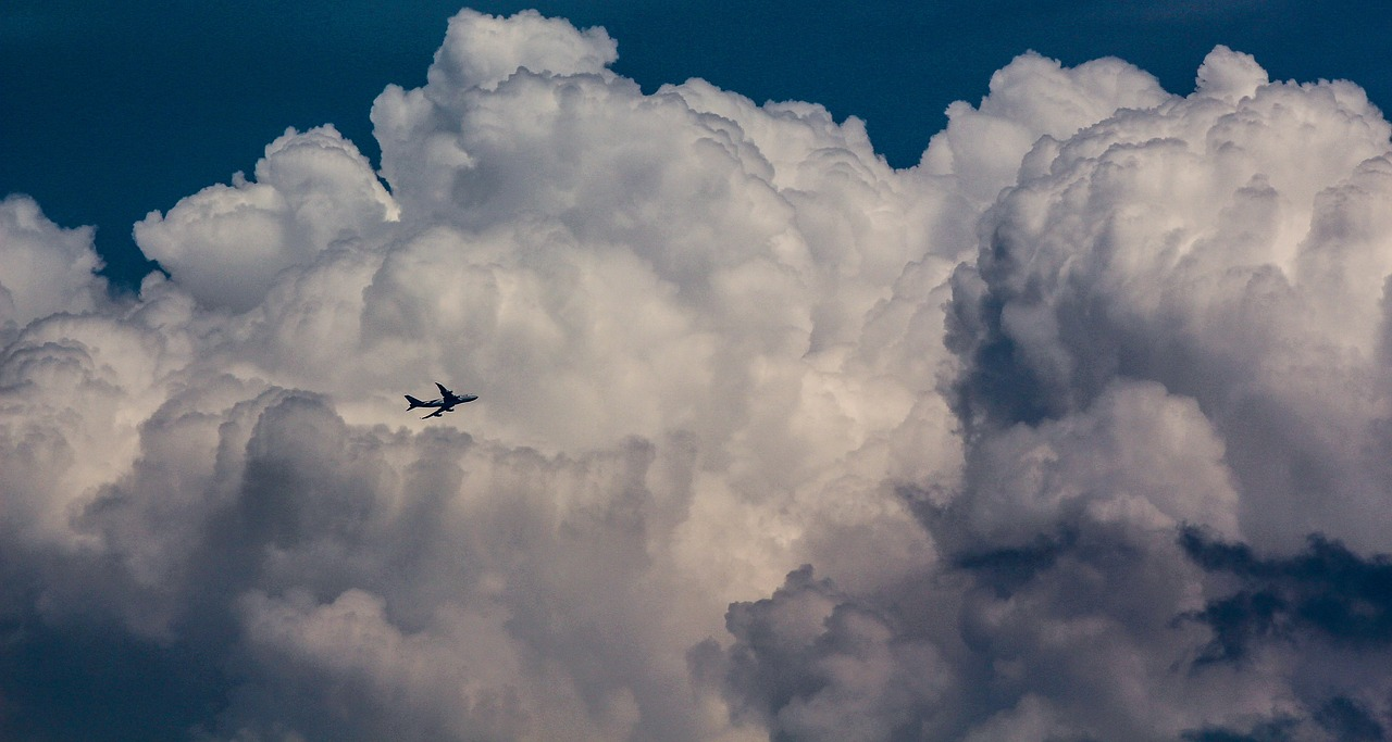 a plane flying in the clouds